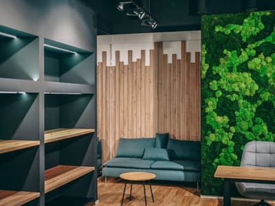 The Šantovka Star(t)s showroom with a moss wall and timber cladding